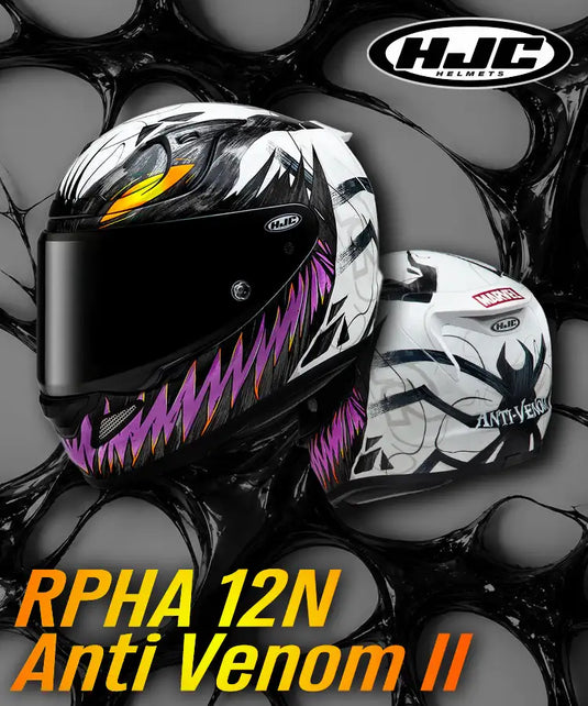 Casco de motocicleta con protección para ciclistas HJC blanco y negro modelo rpha 12n, antiveneno, con vibrantes acentos morados, naranjas y amarillos, que muestran un diseño amenazante de araña.