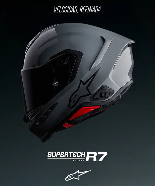 Un elegante casco de motocicleta Alpinestars Supertech R7 en gris mate y negro con costuras de acento rojo.