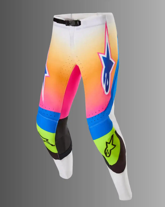 Pantalones de motocross coloridos con un diseño degradado.